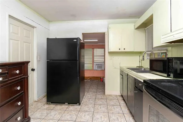 a bathroom with a granite countertop toilet a sink and a mirror