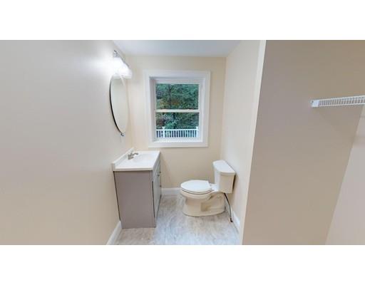 561 Black Brook Road Goffstown, NH 03045 - Photo 14 of 36 a bathroom with a toilet a sink and a mirror