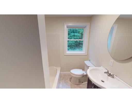 561 Black Brook Road Goffstown, NH 03045 - Photo 19 of 36 a bathroom with a sink vanity mirror and toilet