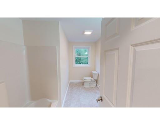 561 Black Brook Road Goffstown, NH 03045 - Photo 25 of 36 a open space with a white wall and a toilet