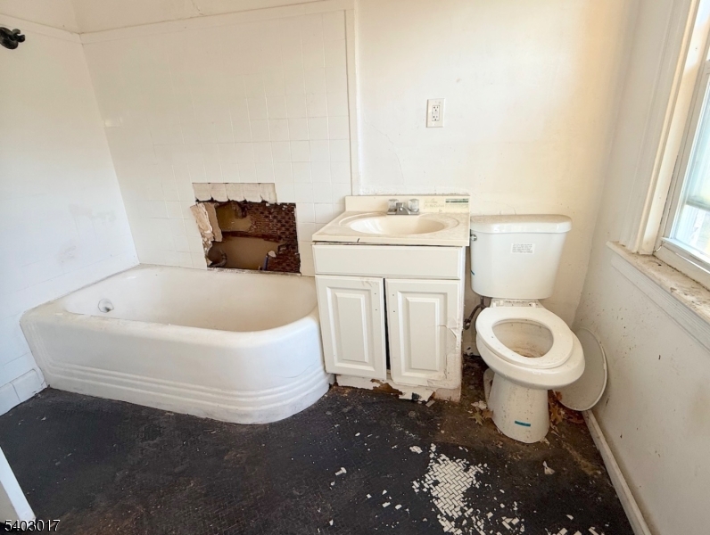 66 Scheerer Avenue Newark, NJ 07112 - Photo 24 of 24 a bathroom with a sink and a toilet