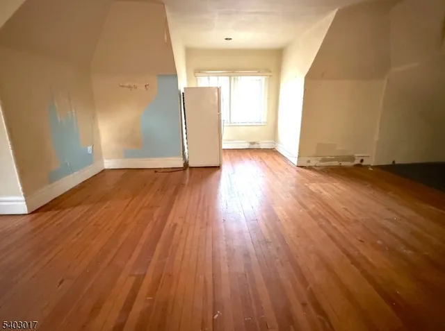 a view of a livingroom with wooden floor