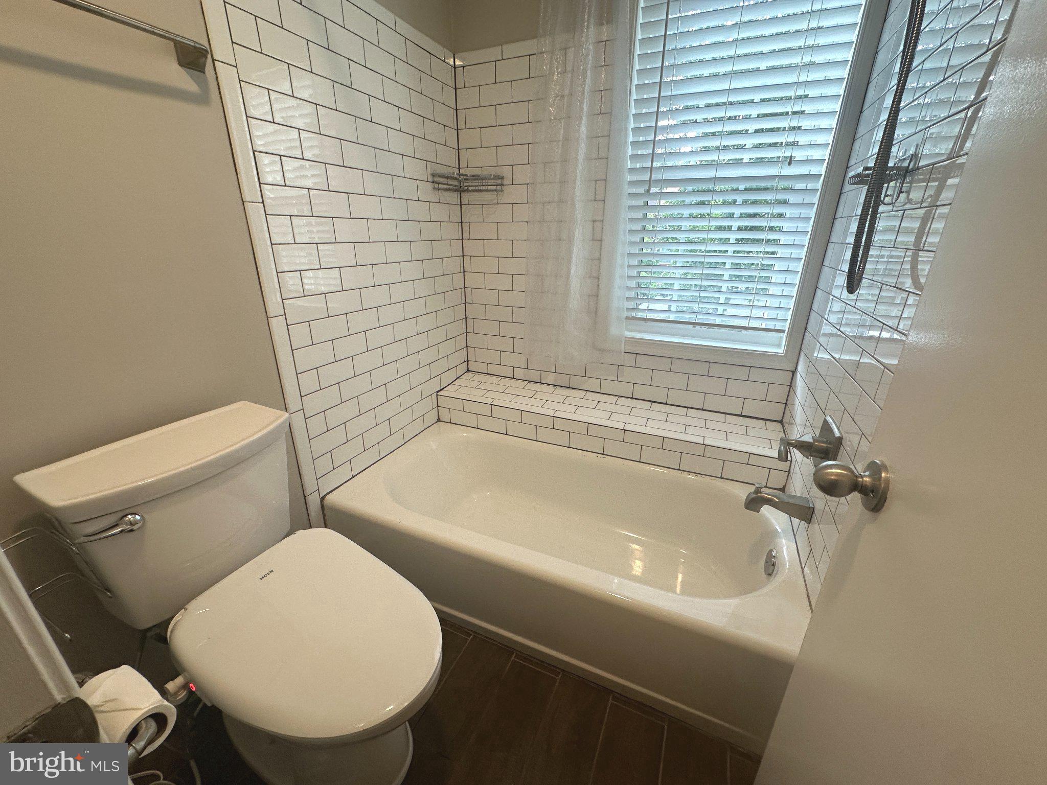 11928 Sentinel Point Court Reston, VA 20191 - Photo 16 of 23 Charming bathroom with modern tiles.