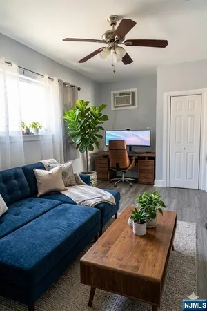 a living room with furniture and a window