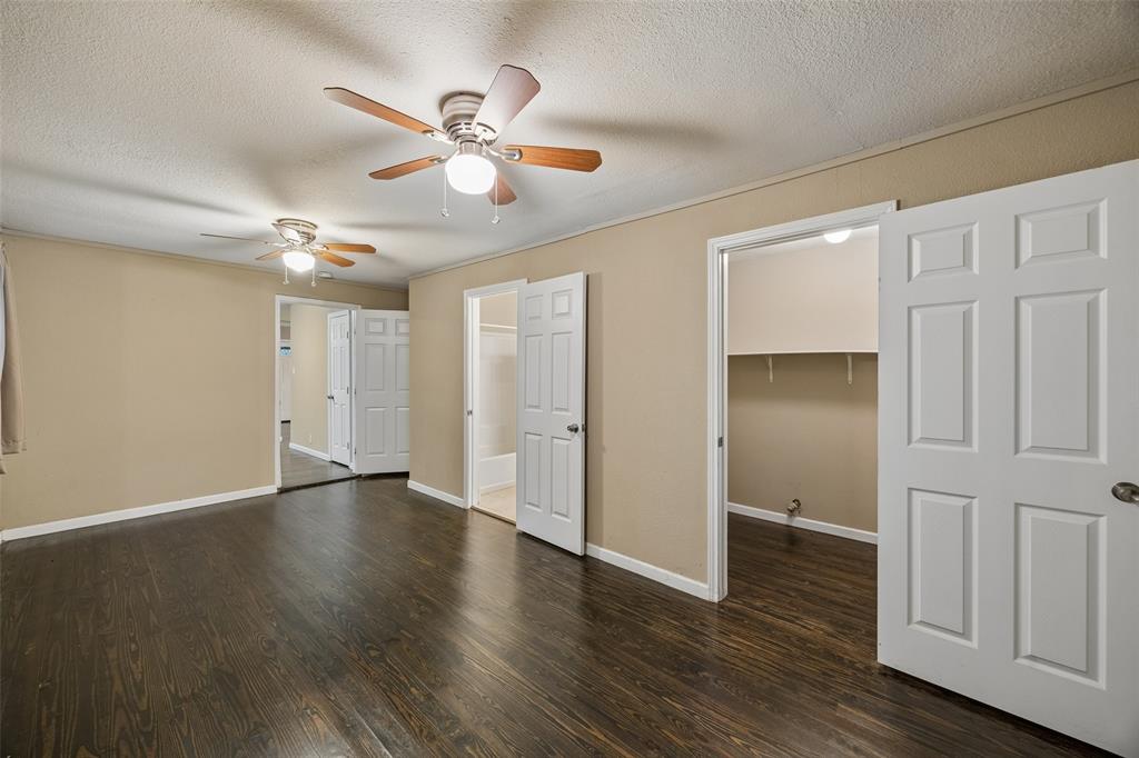 117 Moon Street Cleburne, TX 76033 - Photo 17 of 28 a view of an empty room with wooden floor