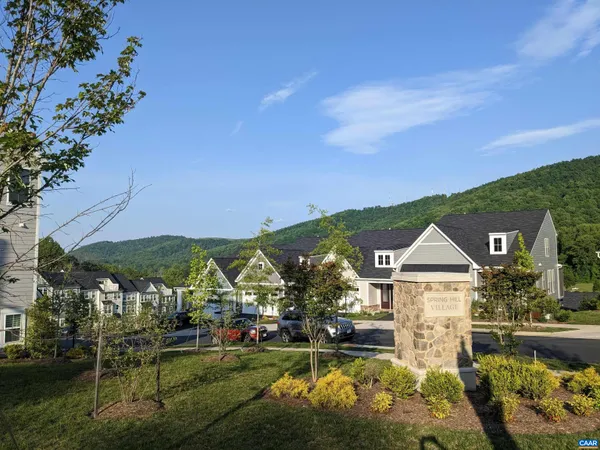 a view of a town with mountains in the background