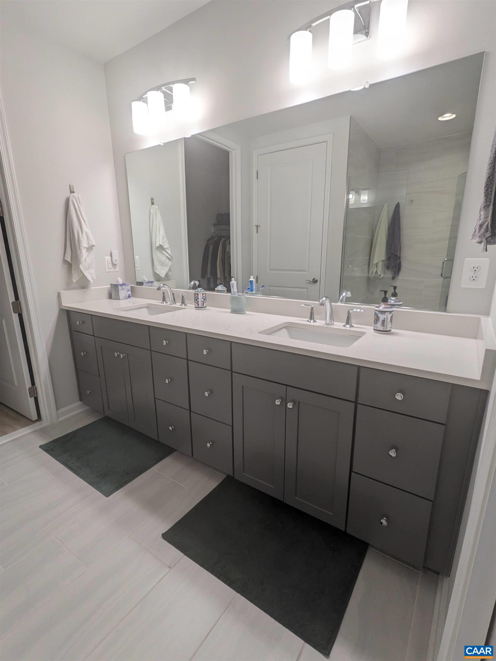 4758 Loyola Way Charlottesville, VA 22902 - Photo 11 of 26 a bathroom with a double vanity sink and mirror