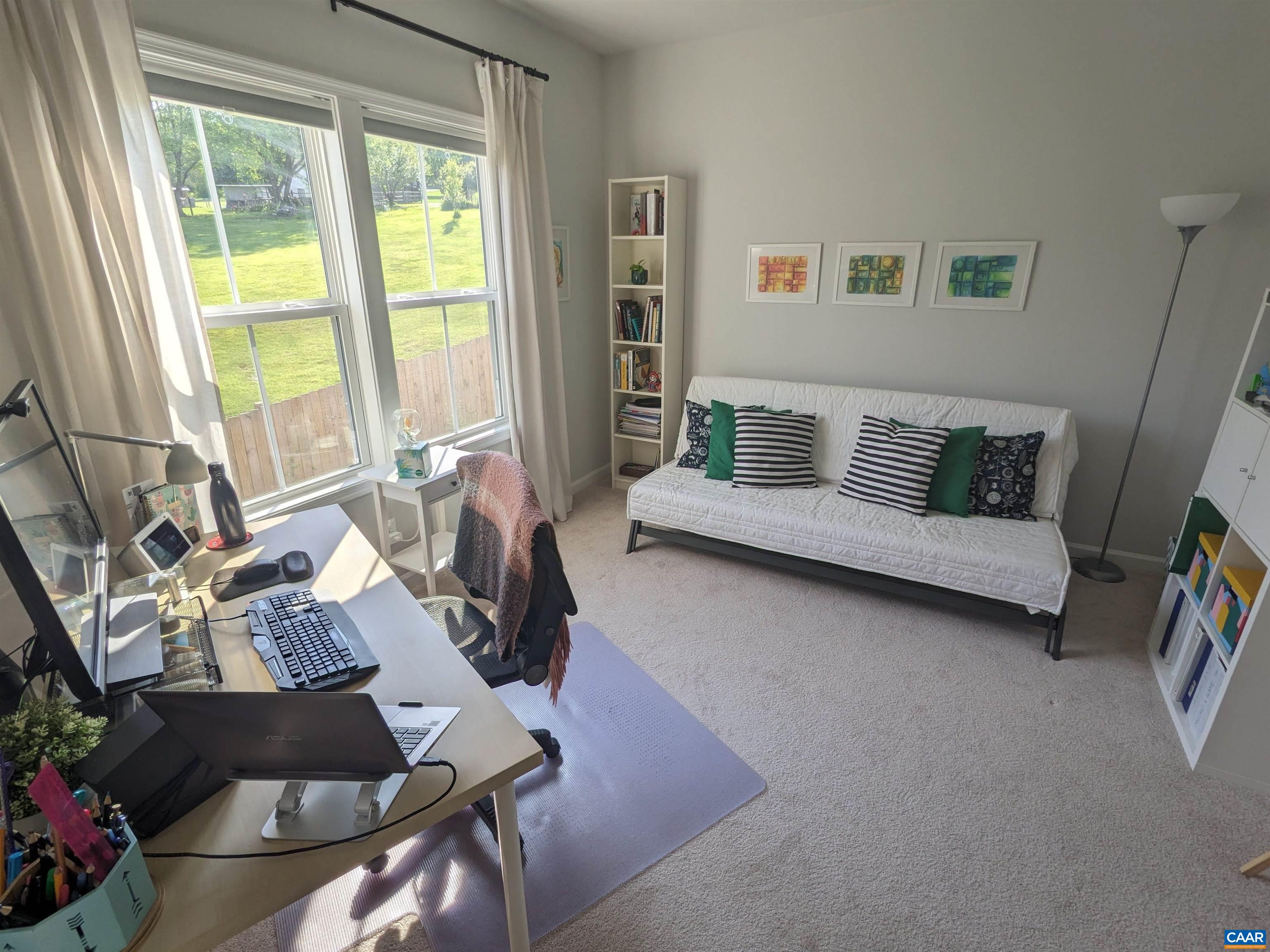 4758 Loyola Way Charlottesville, VA 22902 - Photo 13 of 26 a living room with furniture and a large window