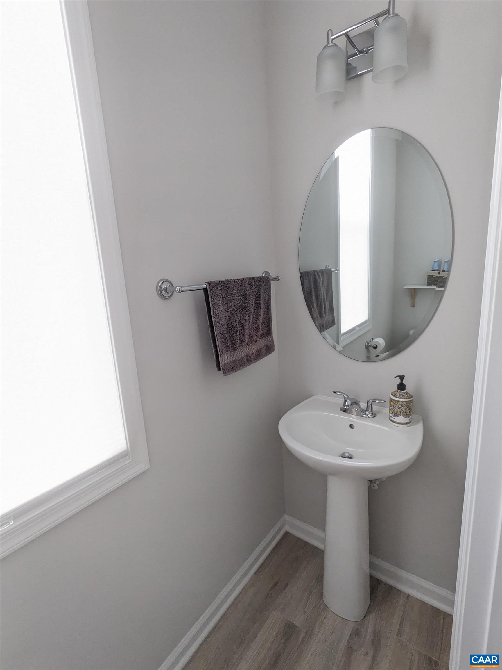 4758 Loyola Way Charlottesville, VA 22902 - Photo 14 of 26 a bathroom with a sink and a mirror