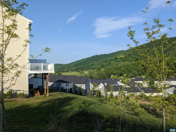 a aerial view of a house with a yard