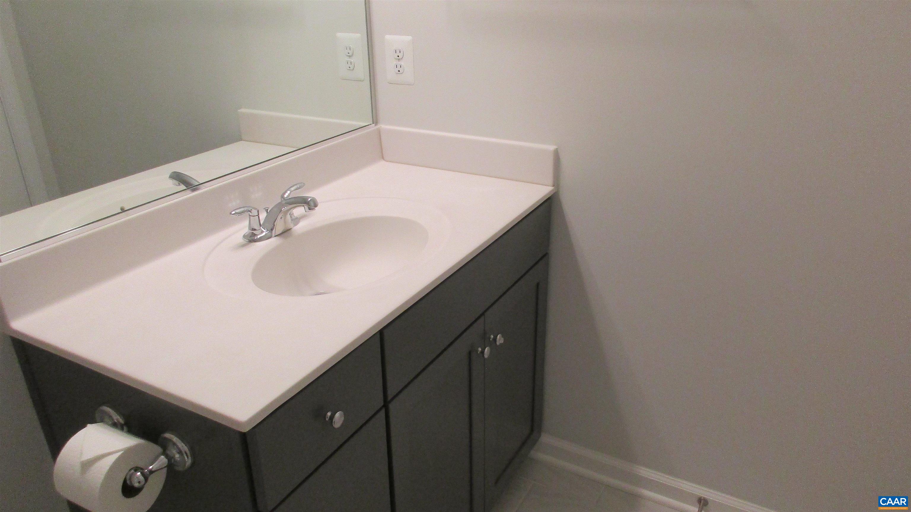 4758 Loyola Way Charlottesville, VA 22902 - Photo 25 of 26 a bathroom with a sink and a mirror