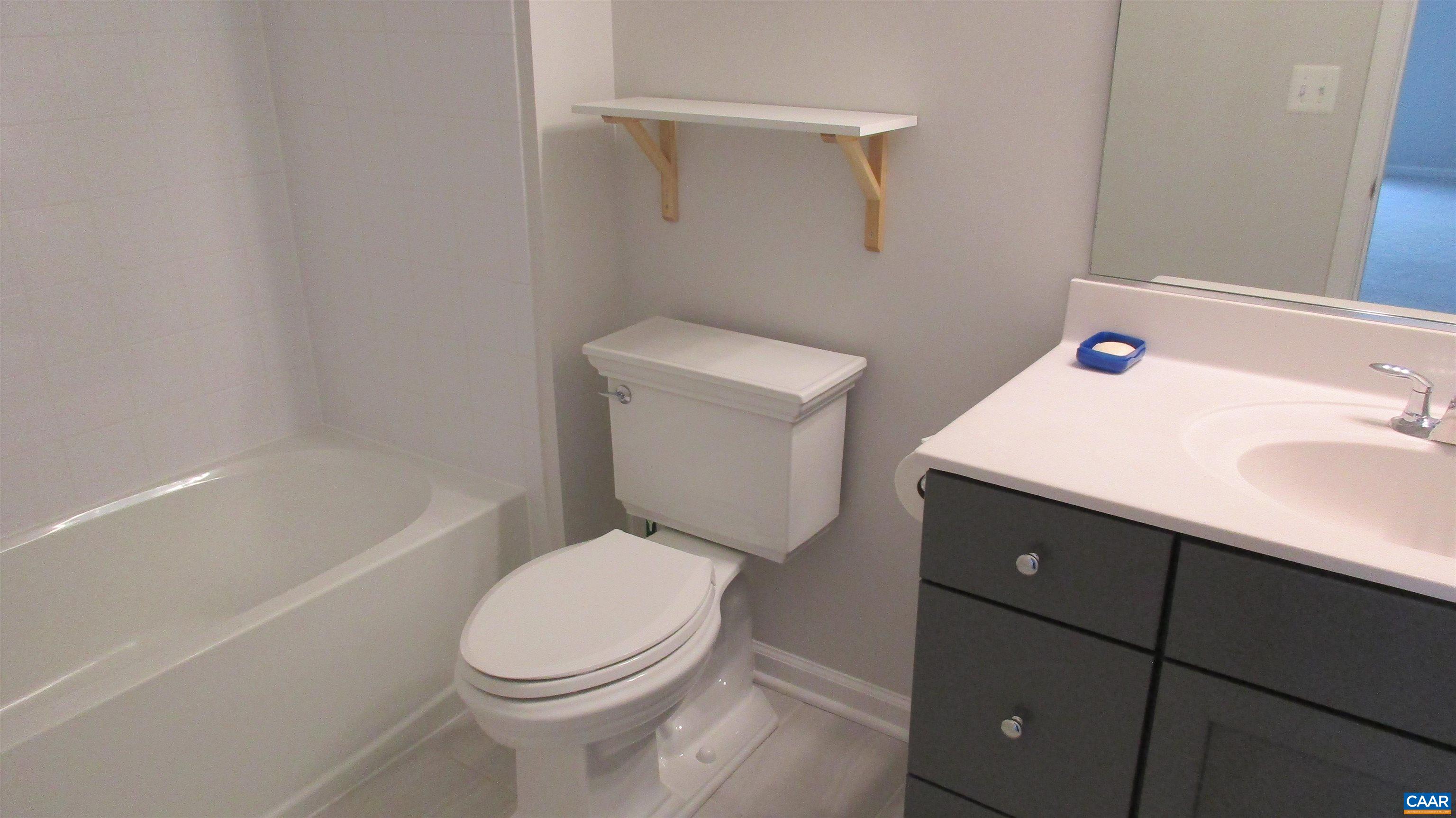 4758 Loyola Way Charlottesville, VA 22902 - Photo 26 of 26 a white toilet sitting next to a bath tub