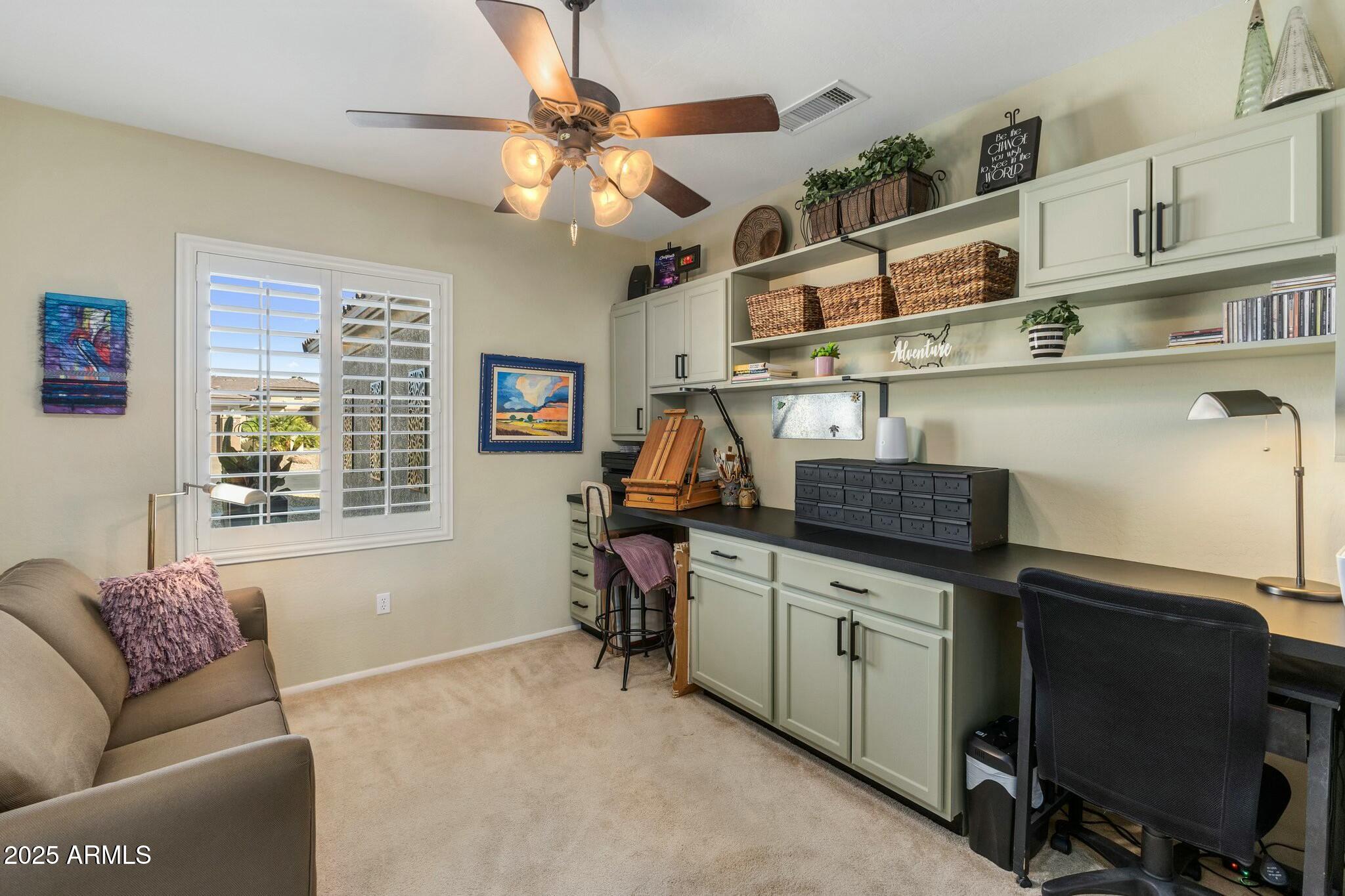 20139 North Rawhide Way Surprise, AZ 85387 - Photo 18 of 30 a livingroom with workspace and a window