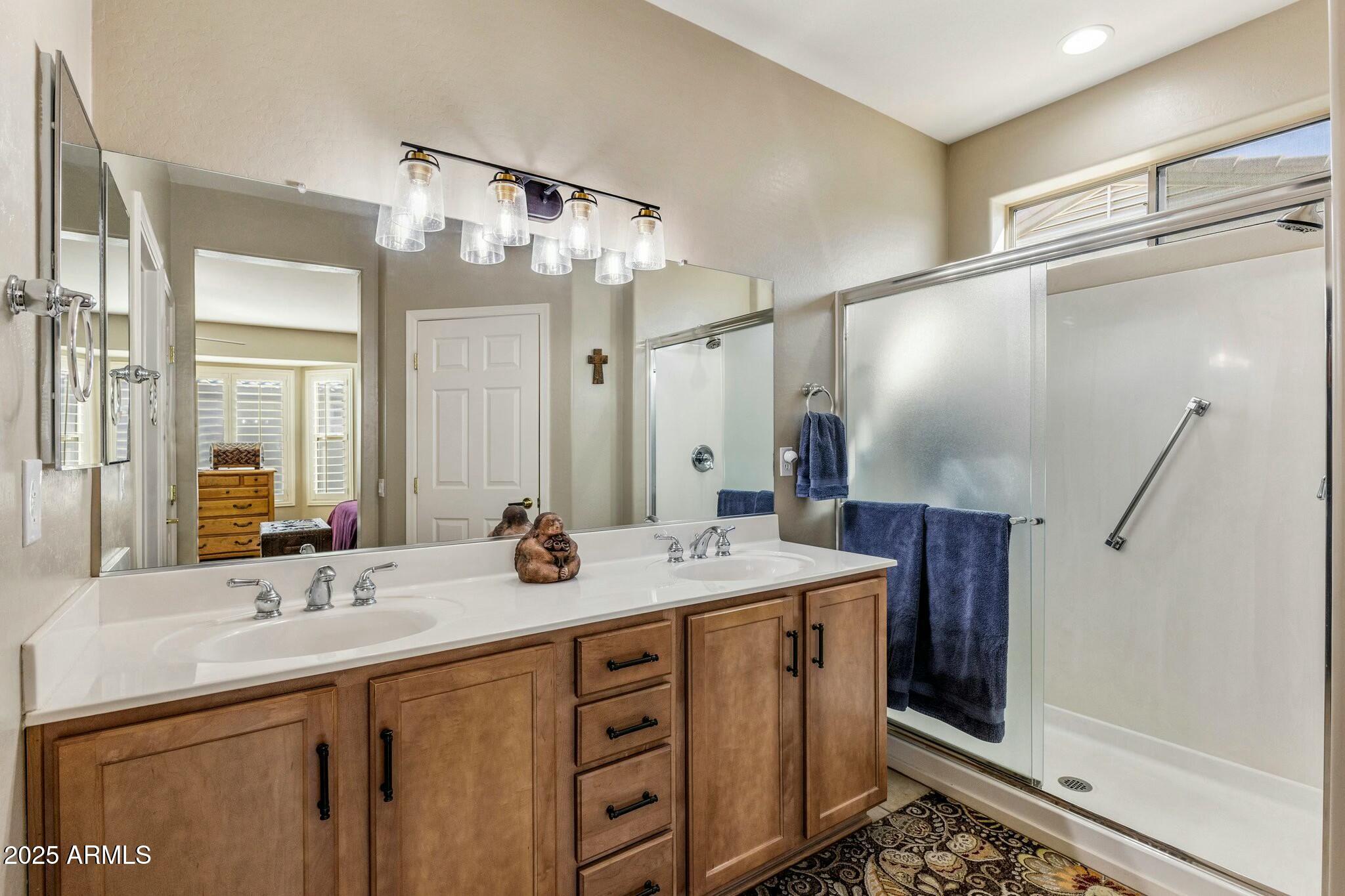 20139 North Rawhide Way Surprise, AZ 85387 - Photo 21 of 30 a bathroom with a double vanity sink mirror and double