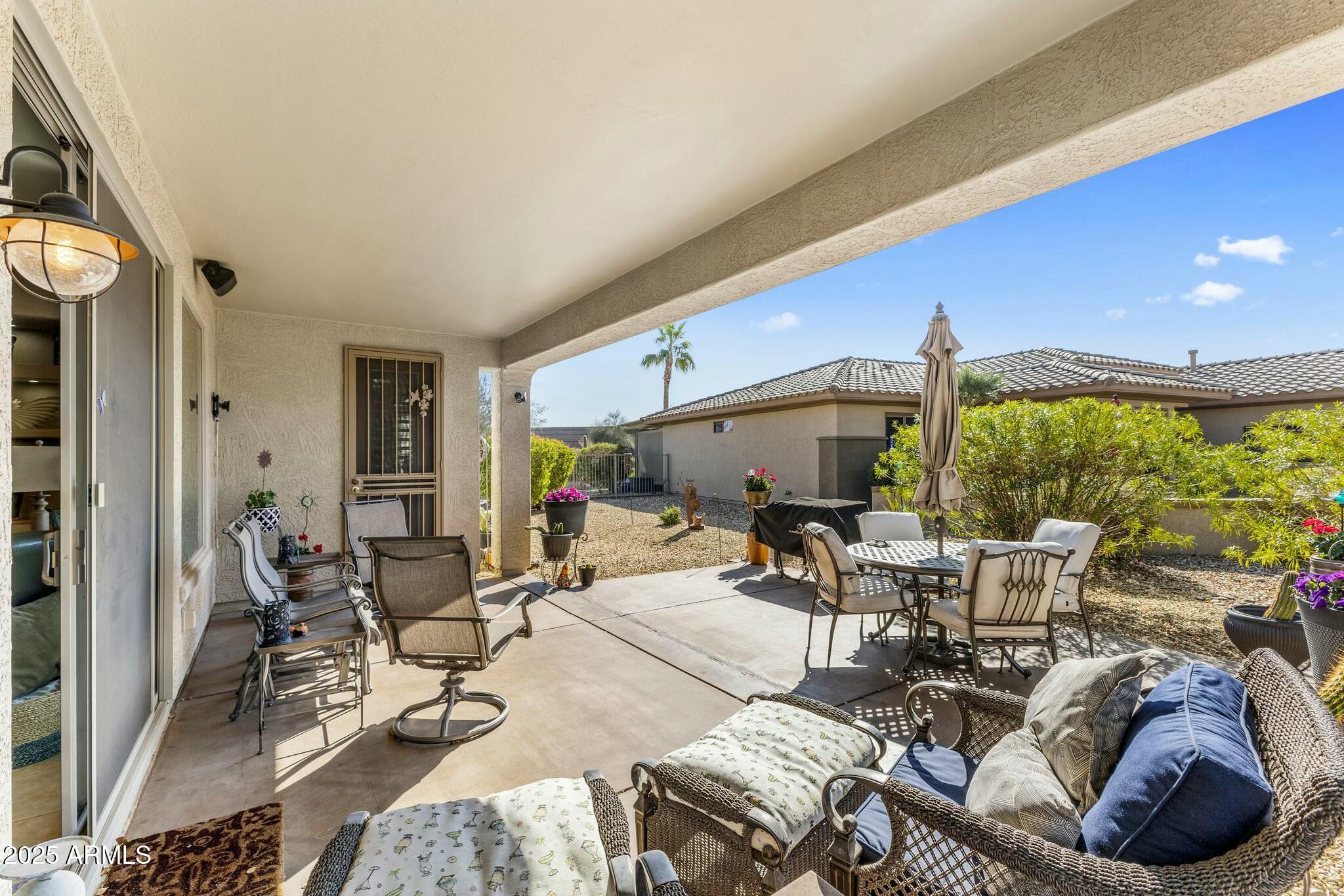 20139 North Rawhide Way Surprise, AZ 85387 - Photo 27 of 30 a living room with furniture and a large window