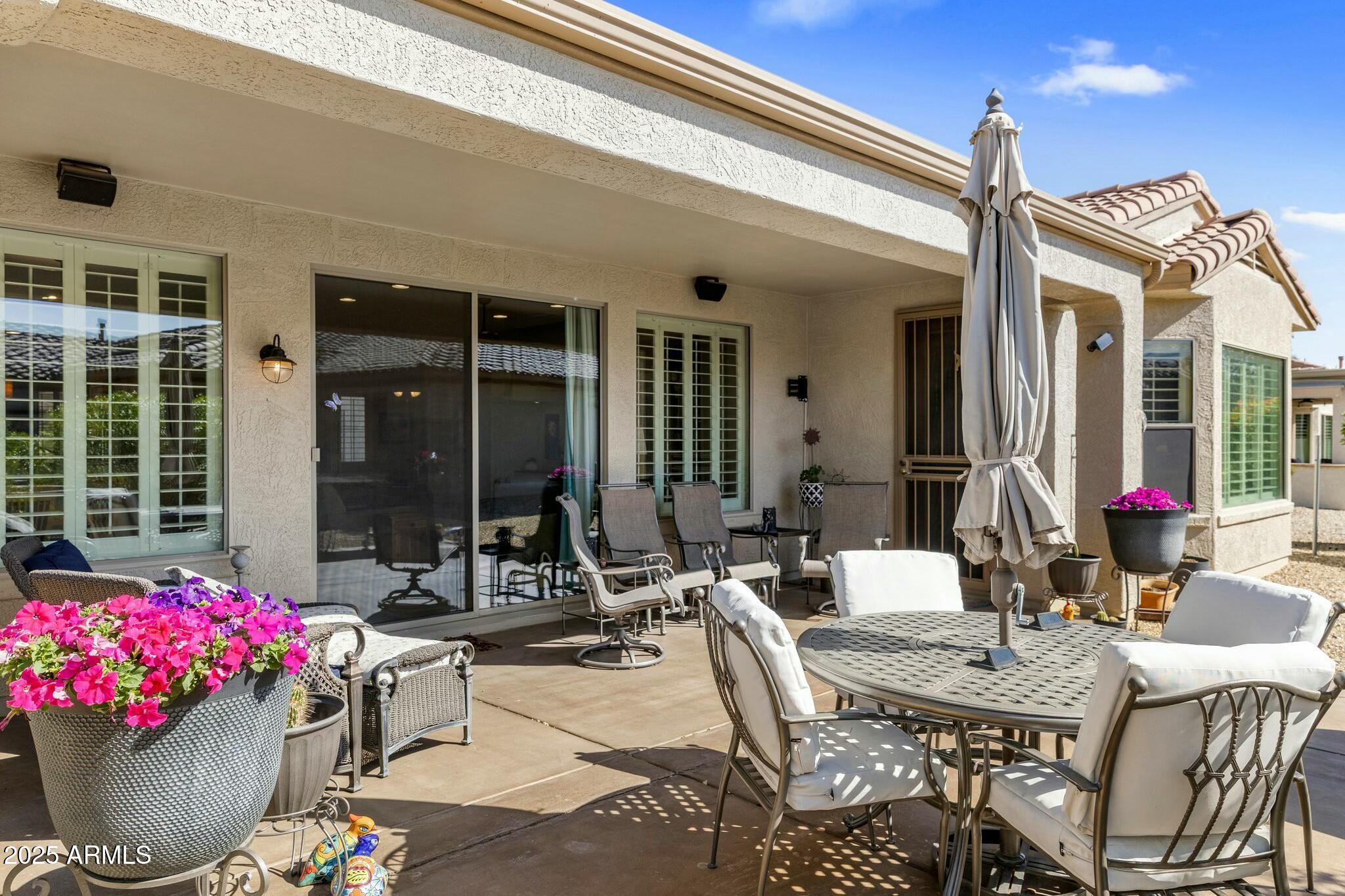 20139 North Rawhide Way Surprise, AZ 85387 - Photo 29 of 30 a view of a patio with couches table and chairs and potted plants
