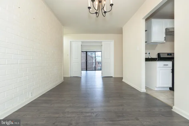 a view of a kitchen cabinets and wooden floor
