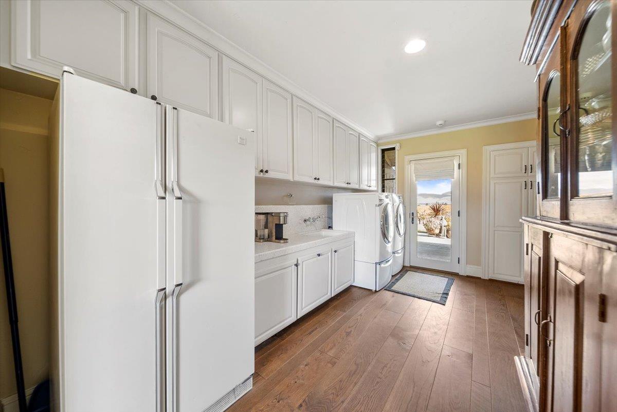 38280 Arroyo Seco Road Soledad, CA 93960 - Photo 19 of 41 a kitchen with white cabinets and white stainless steel appliances