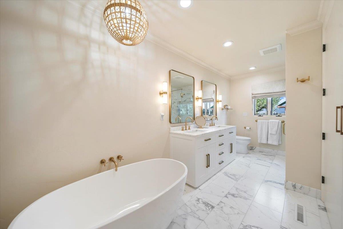 38280 Arroyo Seco Road Soledad, CA 93960 - Photo 25 of 41 a bathroom with a sink a mirror and a bathtub