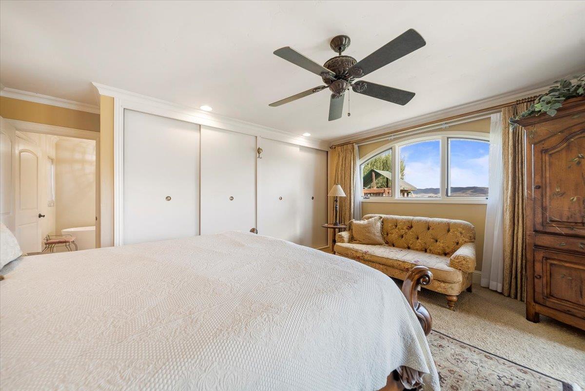 38280 Arroyo Seco Road Soledad, CA 93960 - Photo 28 of 41 a bedroom with a bed and a large mirror