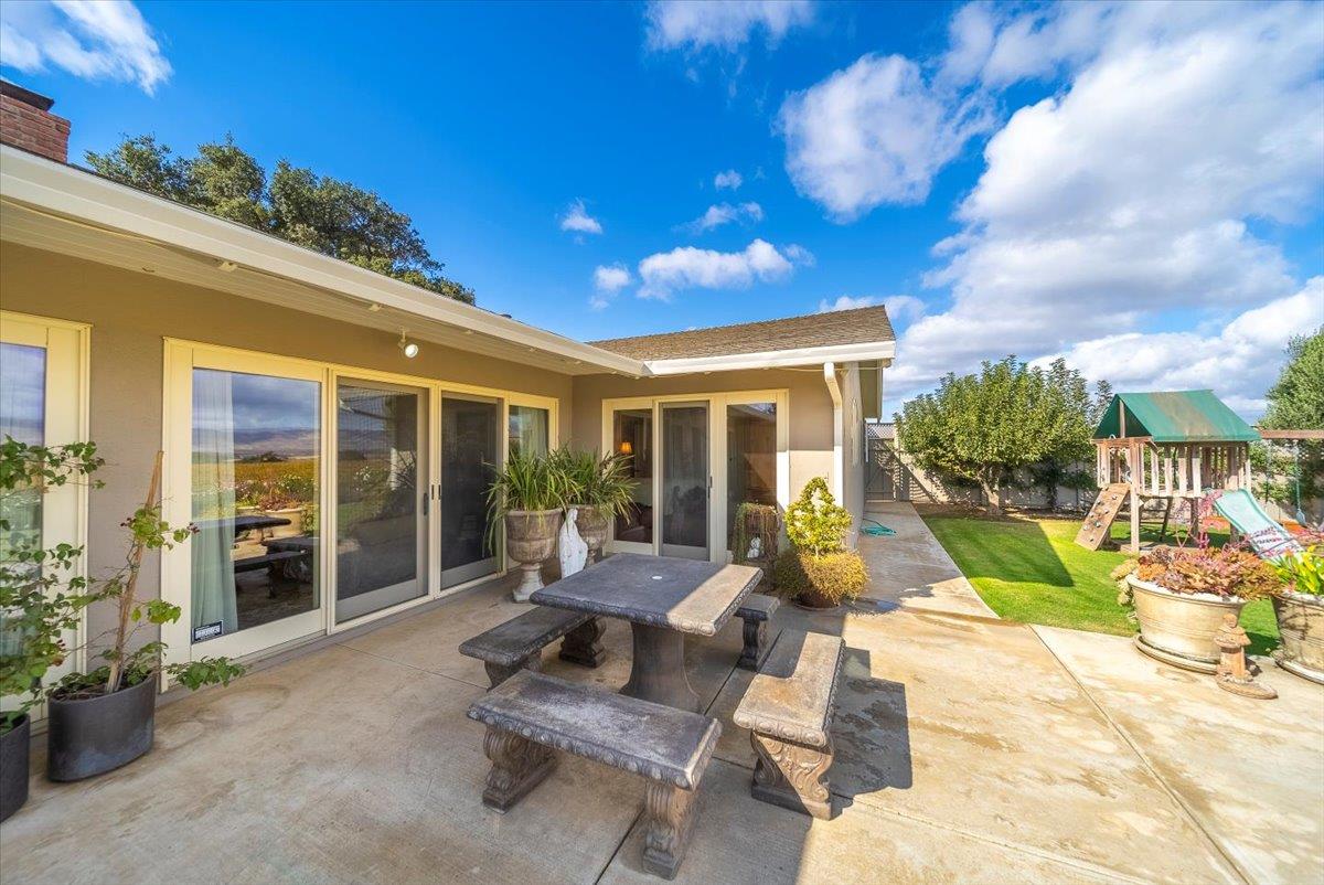 38280 Arroyo Seco Road Soledad, CA 93960 - Photo 36 of 41 a view of a patio with couches table and chairs with wooden fence and plants
