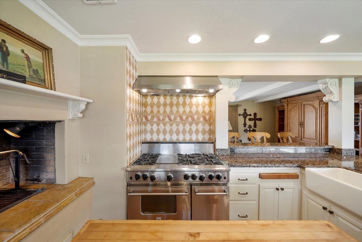 38280 Arroyo Seco Road Soledad, CA 93960 - Photo 6 of 41 a kitchen with a stove and a sink