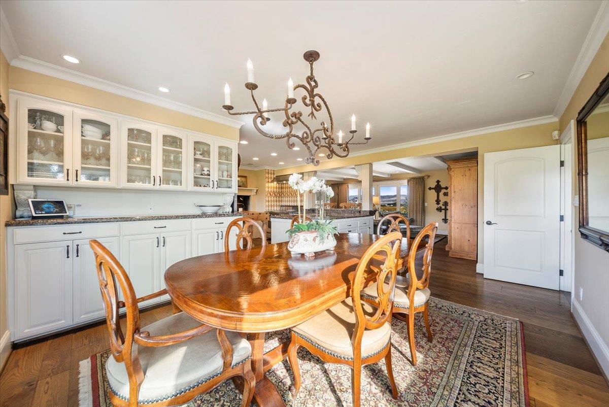 38280 Arroyo Seco Road Soledad, CA 93960 - Photo 9 of 41 a dining room with furniture a chandelier and wooden floor