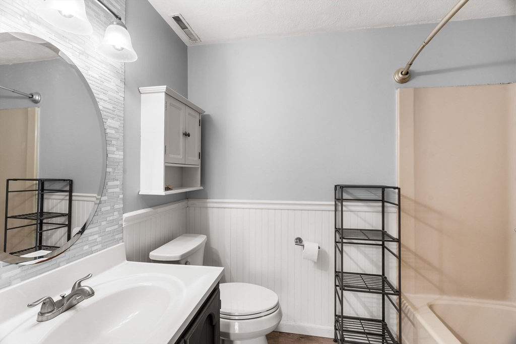 20 Washington Street, Unit 54 Methuen, MA 01844 - Photo 17 of 27 a bathroom with a sink toilet and shower