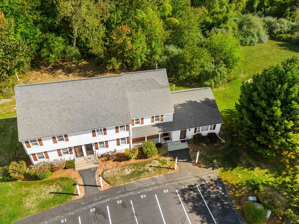 20 Washington Street, Unit 54 Methuen, MA 01844 - Photo 4 of 27 an aerial view of a house with swimming pool and garden