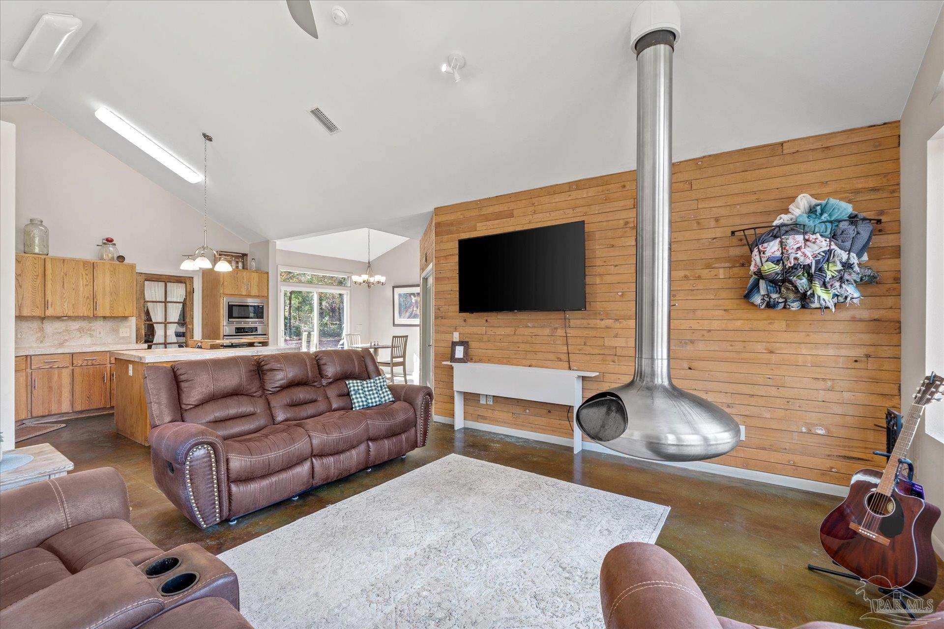 4394 Crabtree Church Road Molino, FL 32577 - Photo 12 of 70 a living room with furniture and a flat screen tv