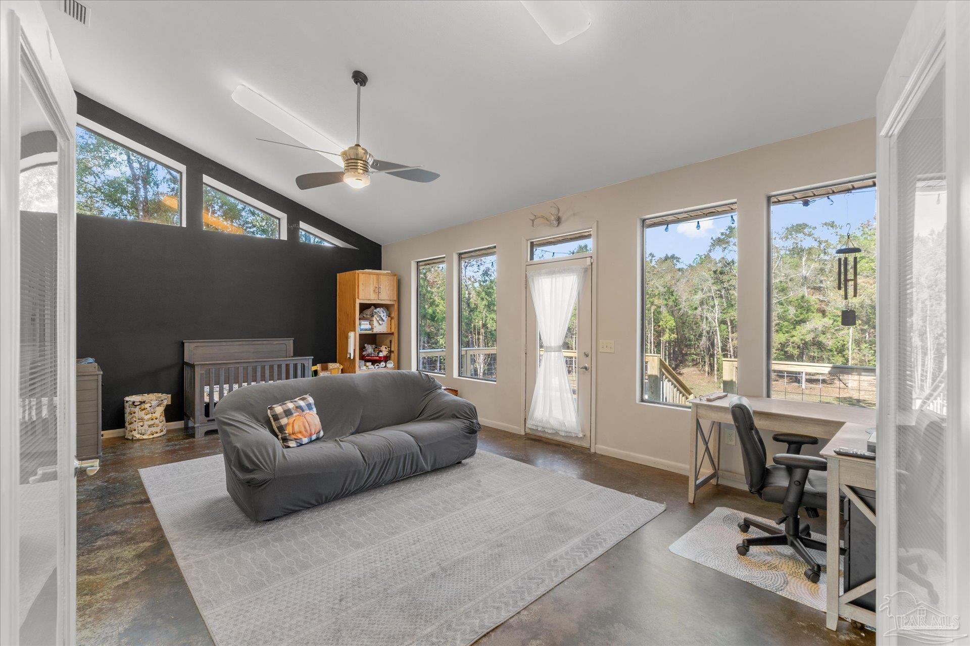 4394 Crabtree Church Road Molino, FL 32577 - Photo 22 of 70 a living room with furniture and a window