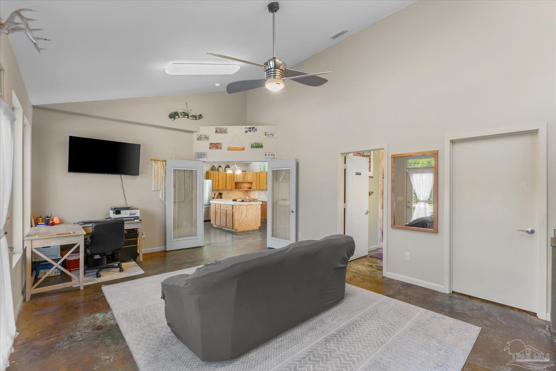 4394 Crabtree Church Road Molino, FL 32577 - Photo 24 of 70 a living room with furniture and a flat screen tv