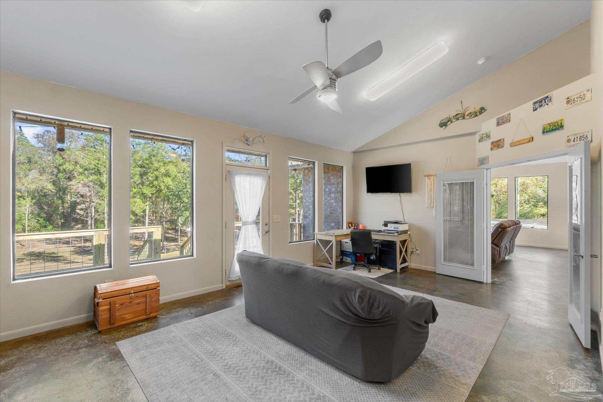 4394 Crabtree Church Road Molino, FL 32577 - Photo 25 of 70 a living room with furniture and large windows
