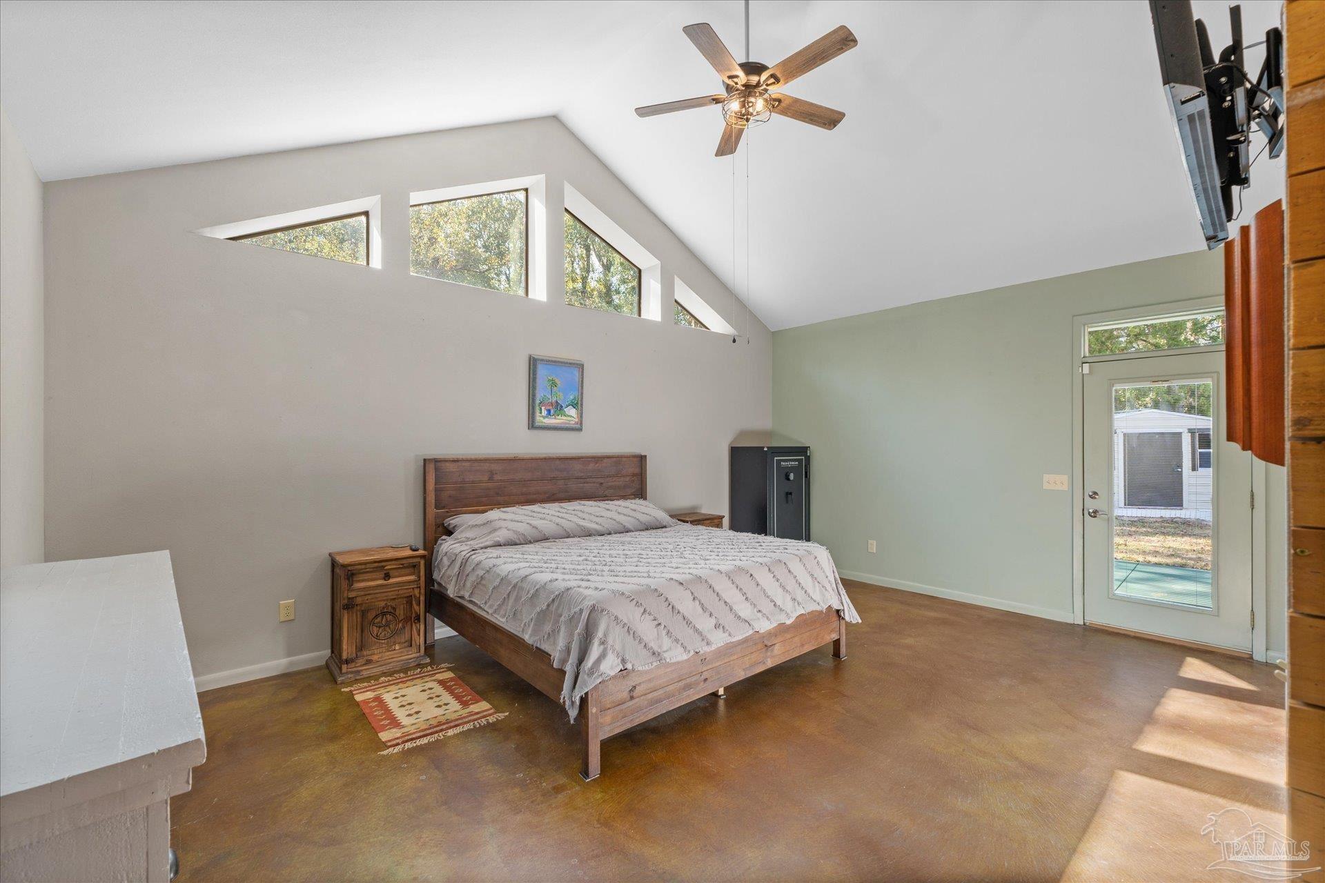 4394 Crabtree Church Road Molino, FL 32577 - Photo 30 of 70 a bedroom with a bed and a table