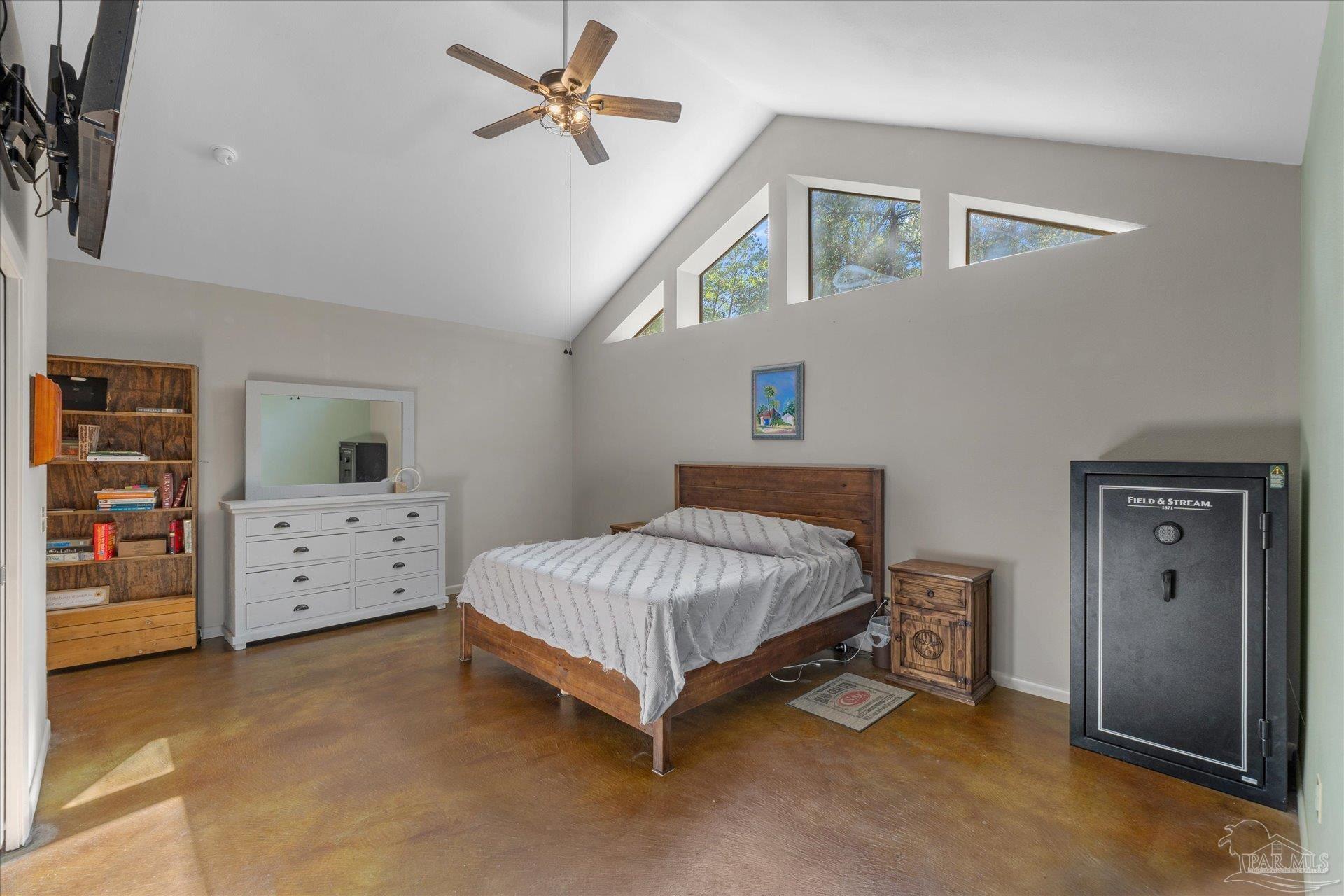 4394 Crabtree Church Road Molino, FL 32577 - Photo 31 of 70 a bedroom with a bed and a walk in closet