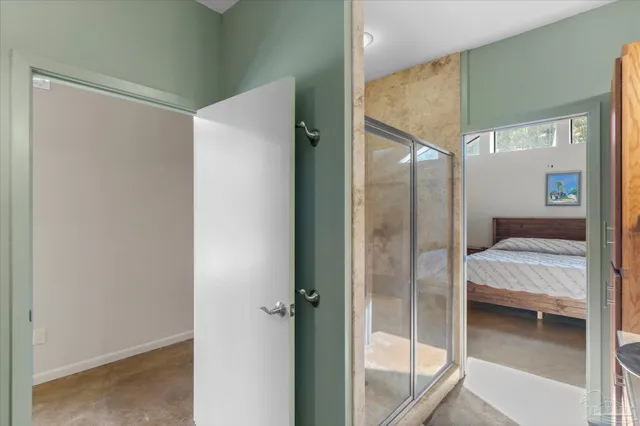 a living room with fish tank and a bookshelf