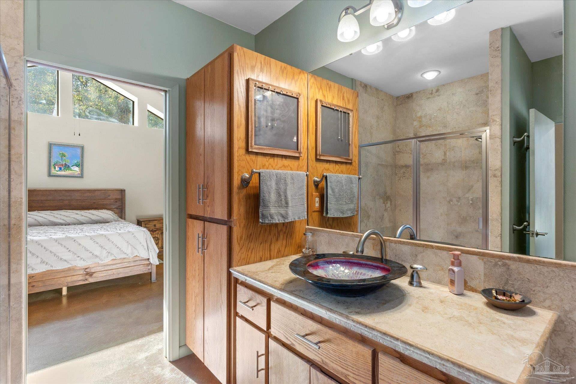 4394 Crabtree Church Road Molino, FL 32577 - Photo 34 of 70 a bathroom with a sink and a mirror