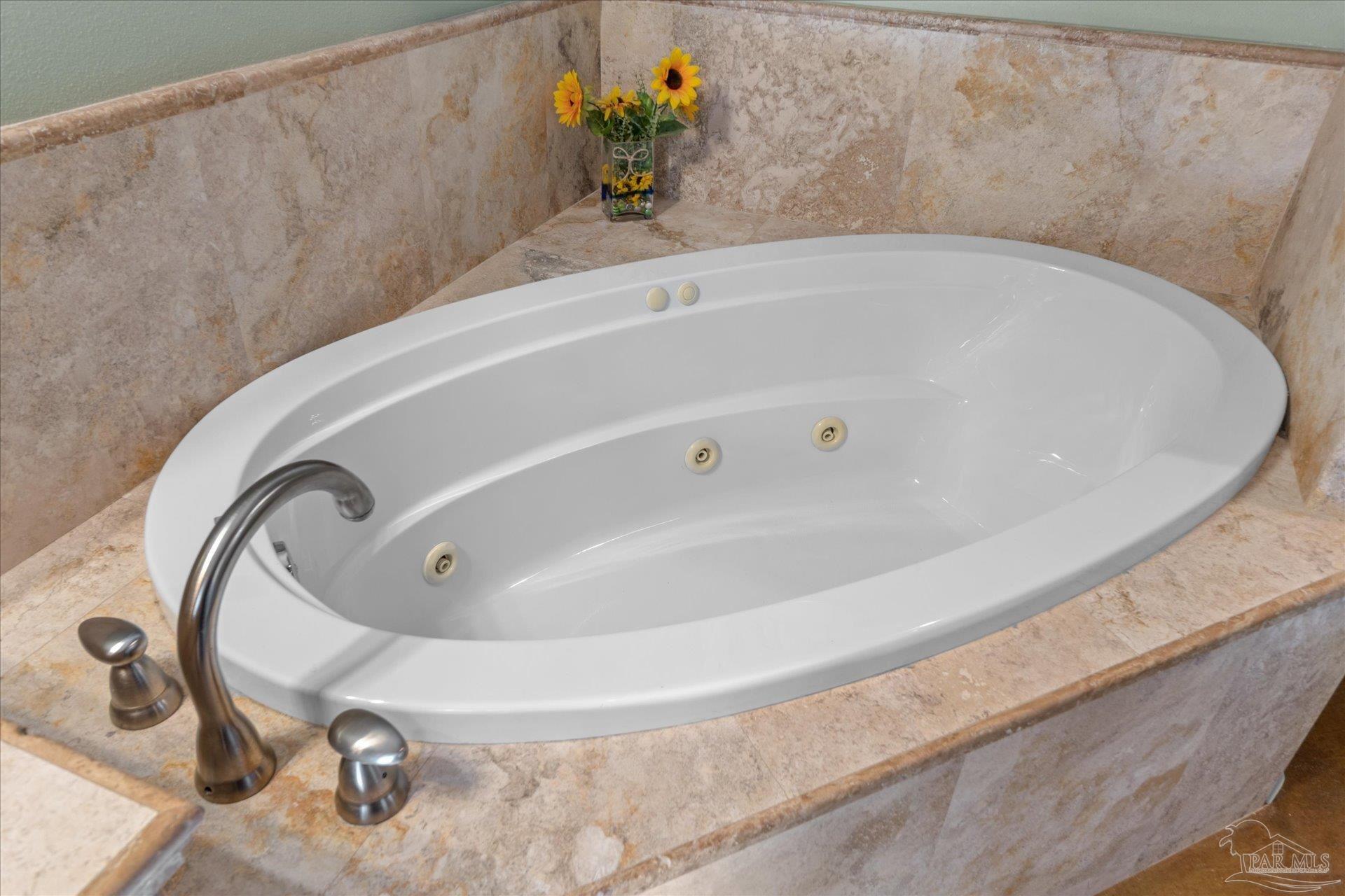 4394 Crabtree Church Road Molino, FL 32577 - Photo 35 of 70 a bath tub sitting in a bathroom