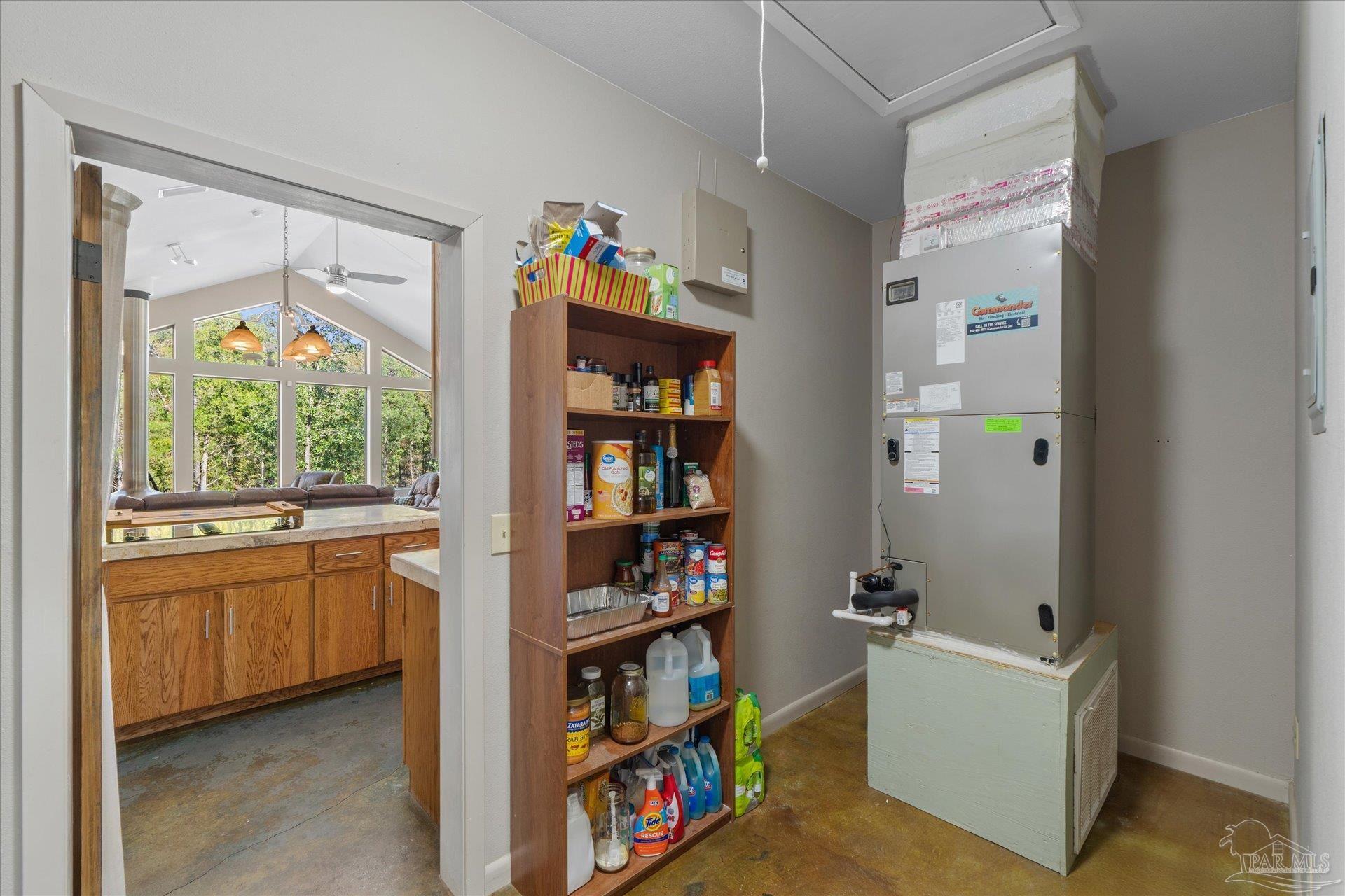 4394 Crabtree Church Road Molino, FL 32577 - Photo 39 of 70 a living room with fish tank and a bookshelf