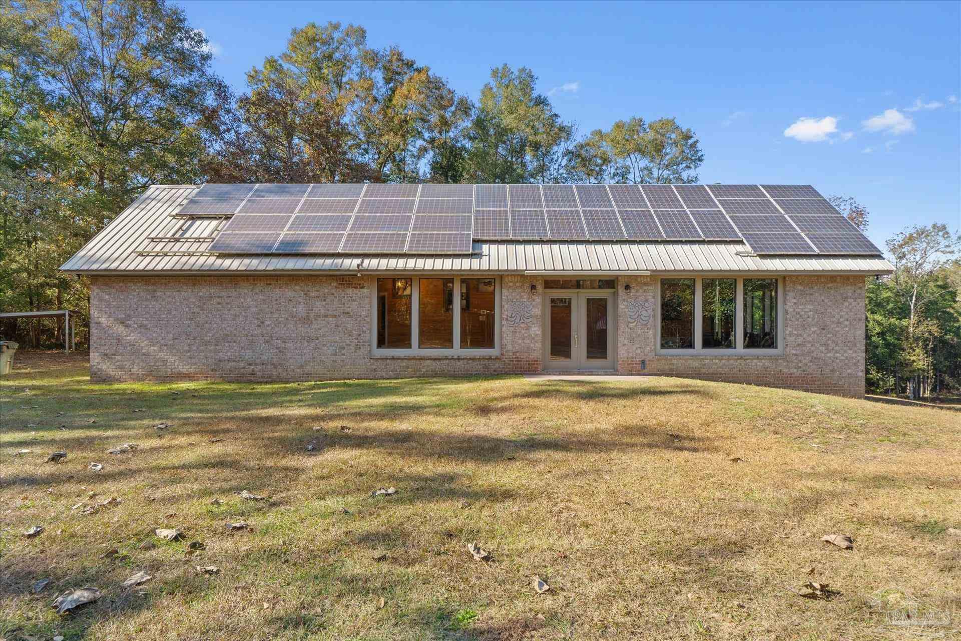 4394 Crabtree Church Road Molino, FL 32577 - Photo 4 of 70 a view of a house with a swimming pool