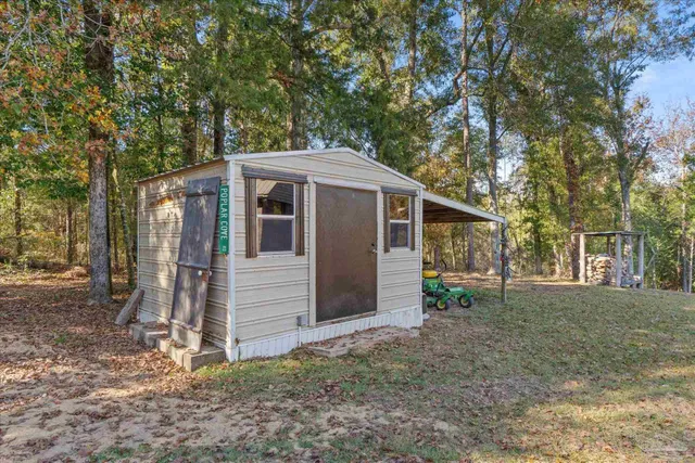 an outdoor space with furniture and umbrella