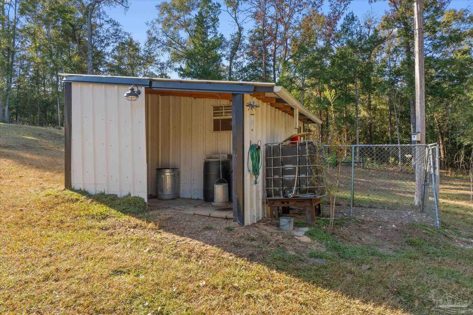 4394 Crabtree Church Road Molino, FL 32577 - Photo 48 of 70 a backyard of a house with lots of green space