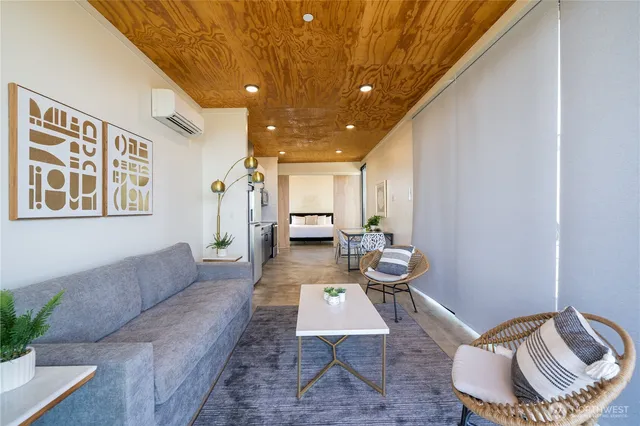a living room with furniture and a rug