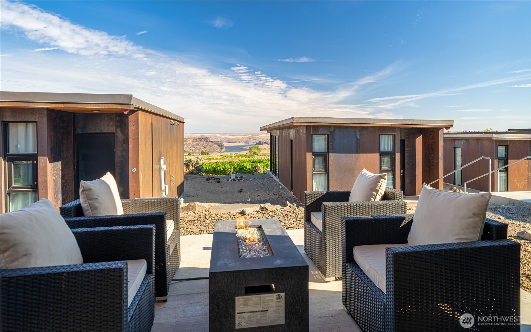 23692 Cliffe Pointe Road Northwest, Unit 5B Quincy, WA 98848 - Photo 3 of 22 a living room with furniture a fireplace and a flat screen tv