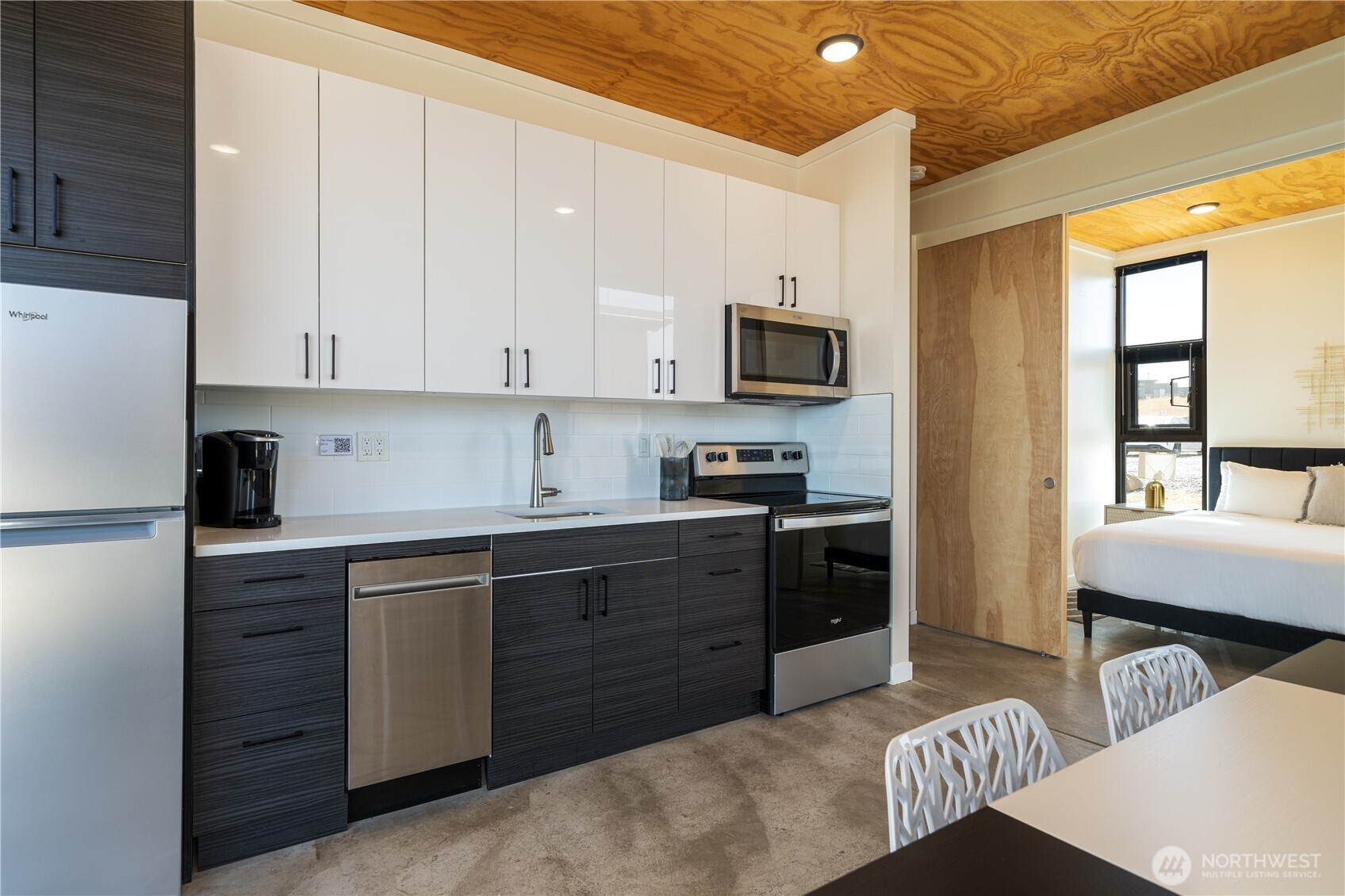 23692 Cliffe Pointe Road Northwest, Unit 5B Quincy, WA 98848 - Photo 10 of 22 a kitchen with stainless steel appliances granite countertop a sink dishwasher stove refrigerator and cabinets