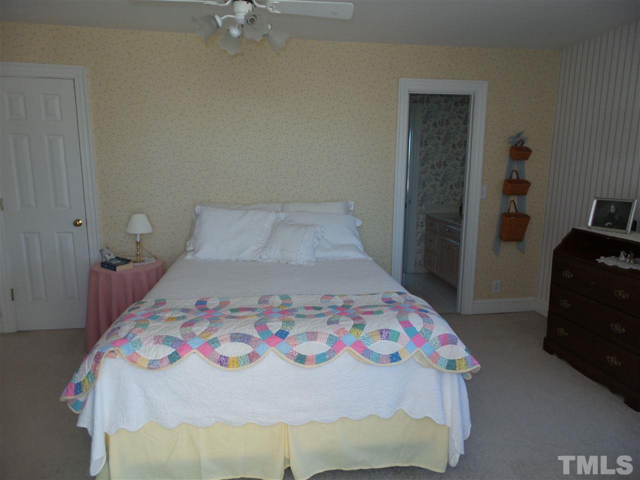 2915 Green Path Road Dunn, NC 28334 - Photo 15 of 24 a bedroom with a bed and a dresser