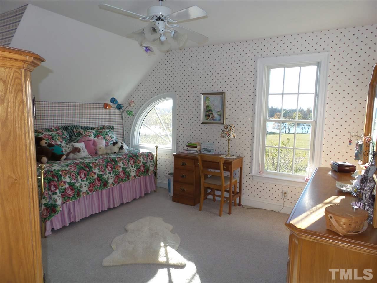 2915 Green Path Road Dunn, NC 28334 - Photo 19 of 24 a bedroom with furniture and a window