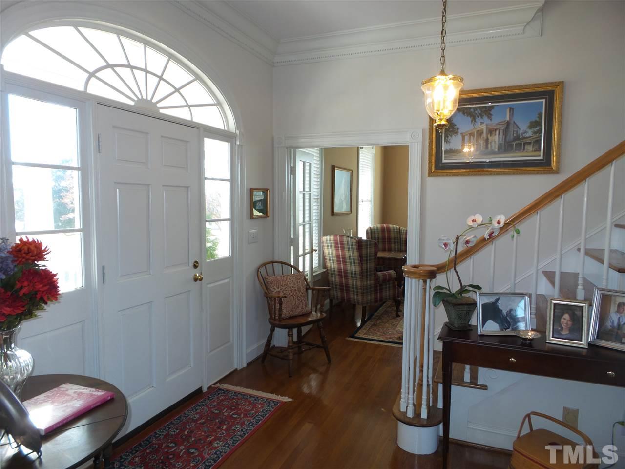 2915 Green Path Road Dunn, NC 28334 - Photo 3 of 24 a living room with furniture and a chandelier