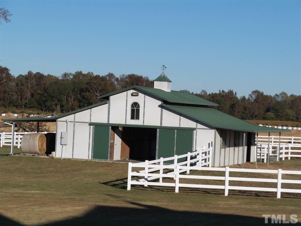 2915 Green Path Road Dunn, NC 28334 - Photo 21 of 24 a view of a white house with a yard