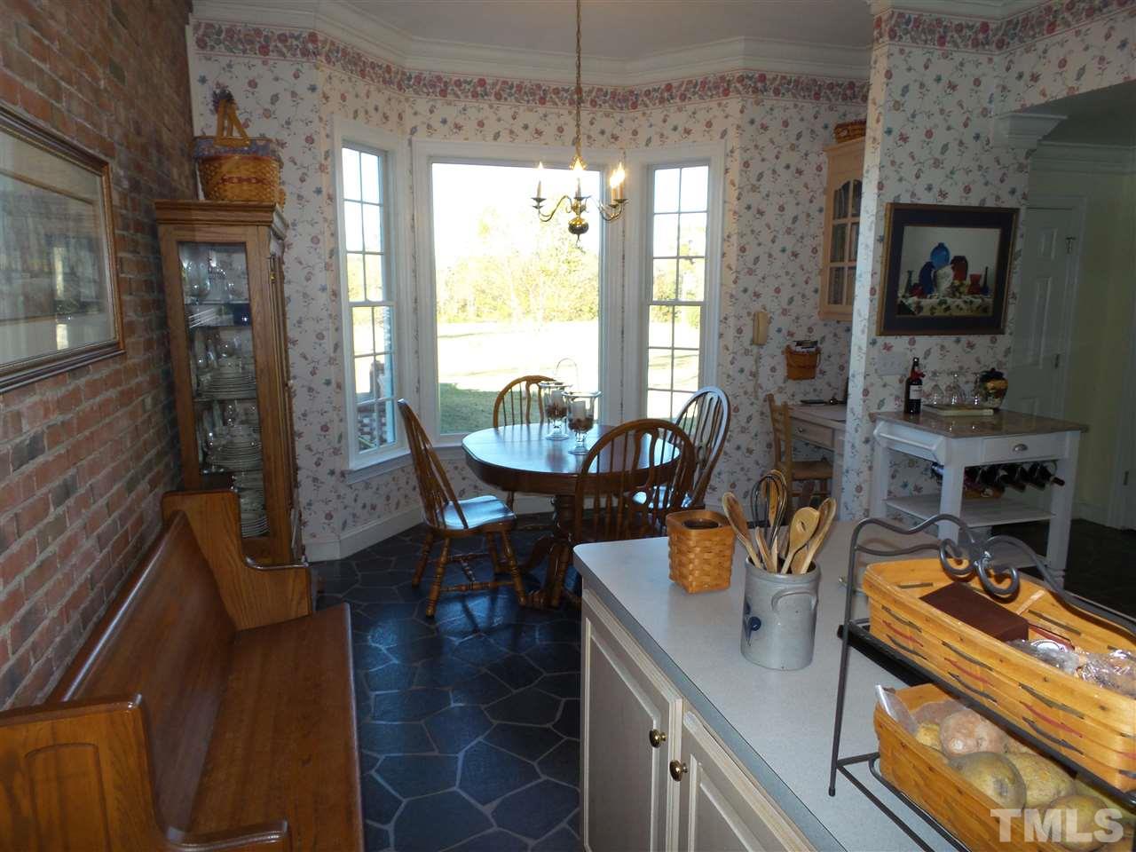 2915 Green Path Road Dunn, NC 28334 - Photo 8 of 24 a view of a dining room with furniture window and outside view
